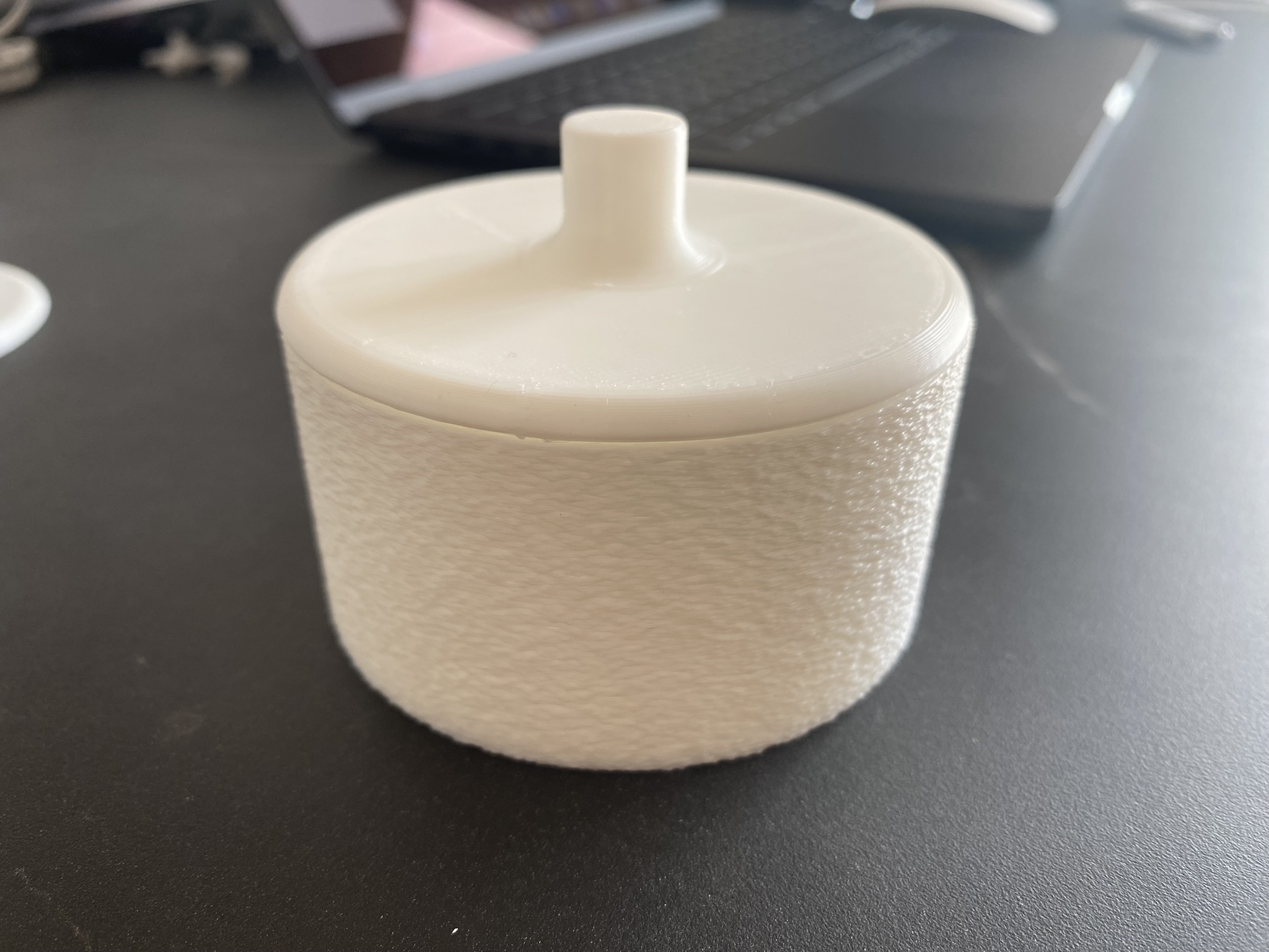 White round box with the lid on